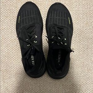 Adidas Black Athletic Shoes with Yellow Accents